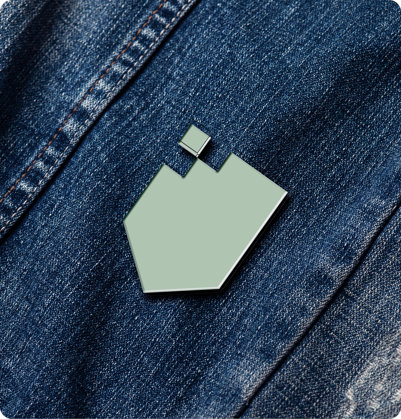XShield Tints branded pin on a jacket